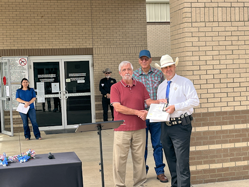 On May 14th, 2025, Compatriot Danny Addington presents Ranger David Stewart with the SAR Law Enforcement Medal, Past President Clarence Burns looks on.