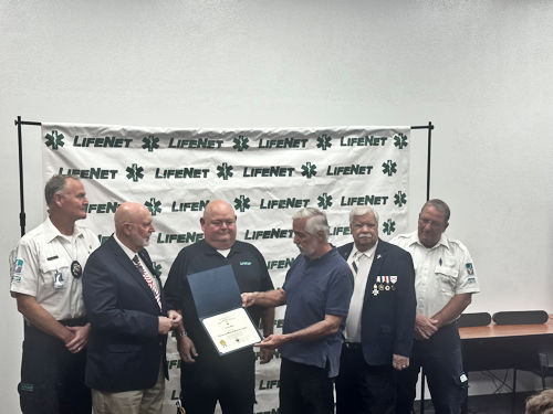 Compatriots Rodney Love, Danny Addington and Joe Reynolds presents the Emergency Medical Services Commendation Medal (EMT) Medal to Texarkana EMT Specialist Chuck Ham